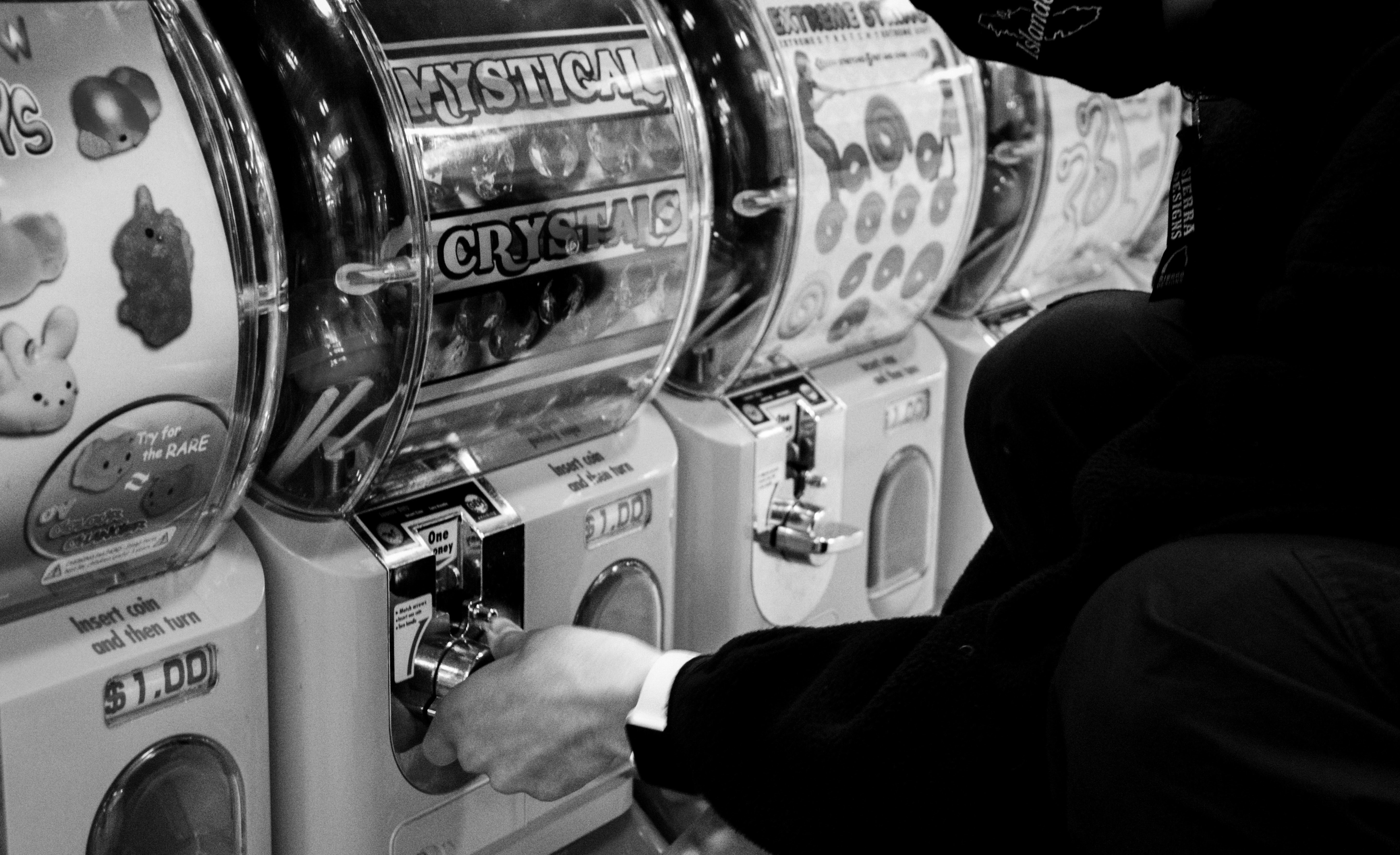 man in black long sleeve shirt holding stainless steel machine